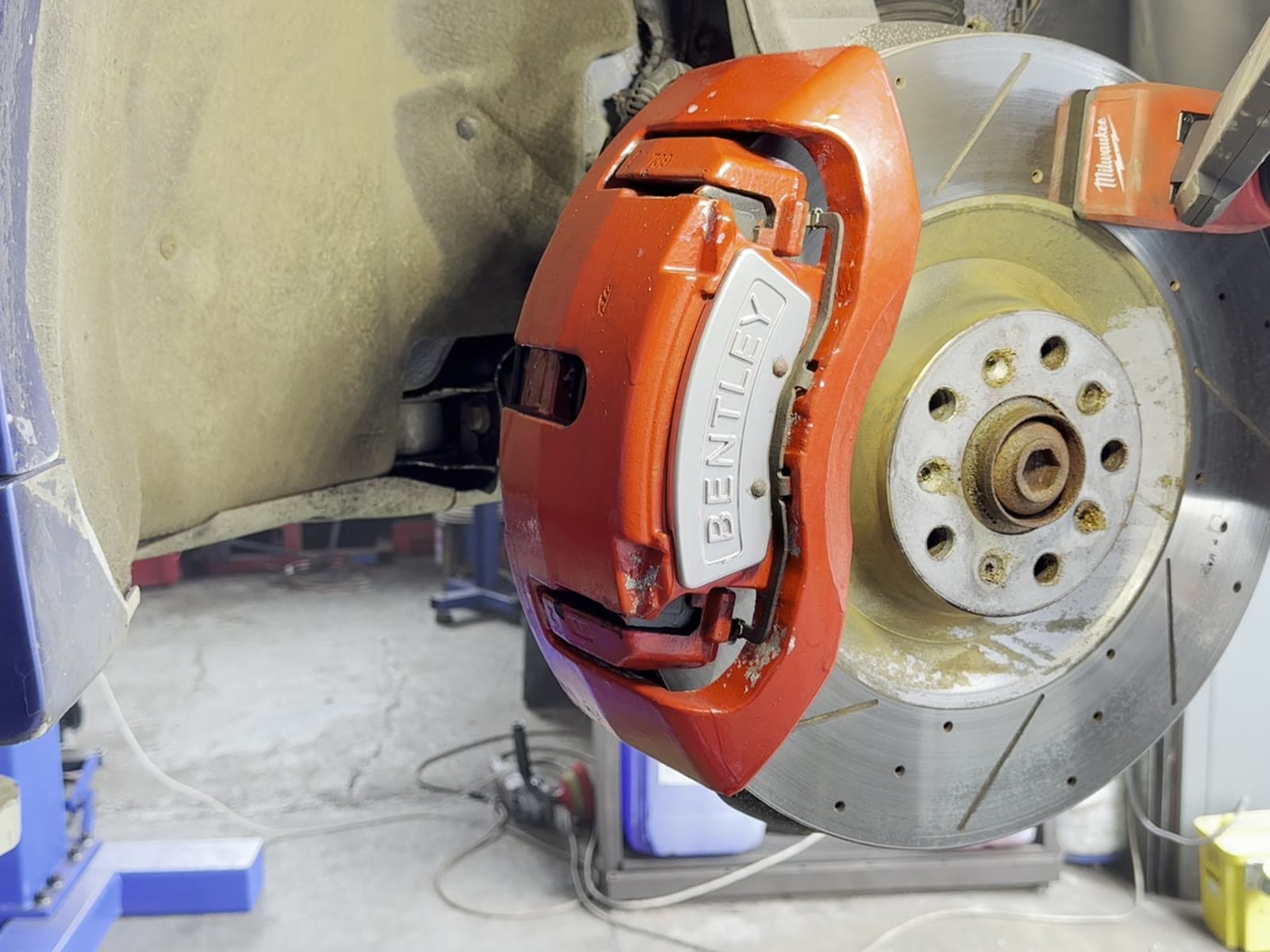 Bentley Onyx GTX 700 front brake caliper restored to vivid factory red after dry ice blasting